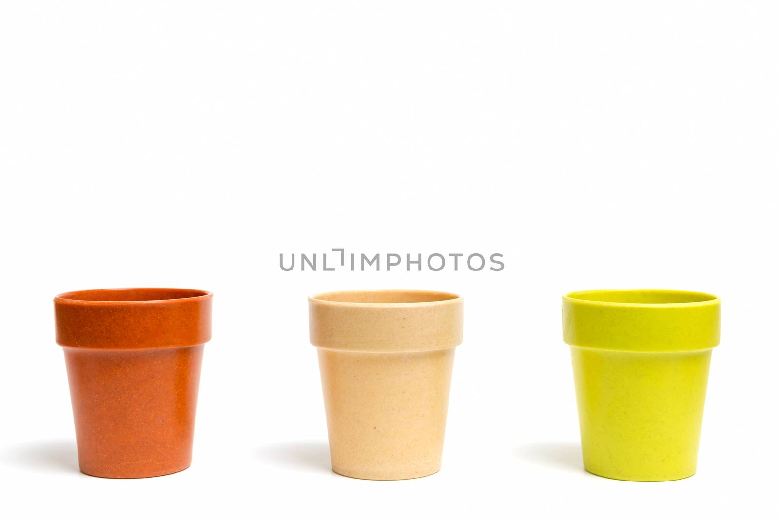 Recycled materials biodegradable tree pot isolated on a white background