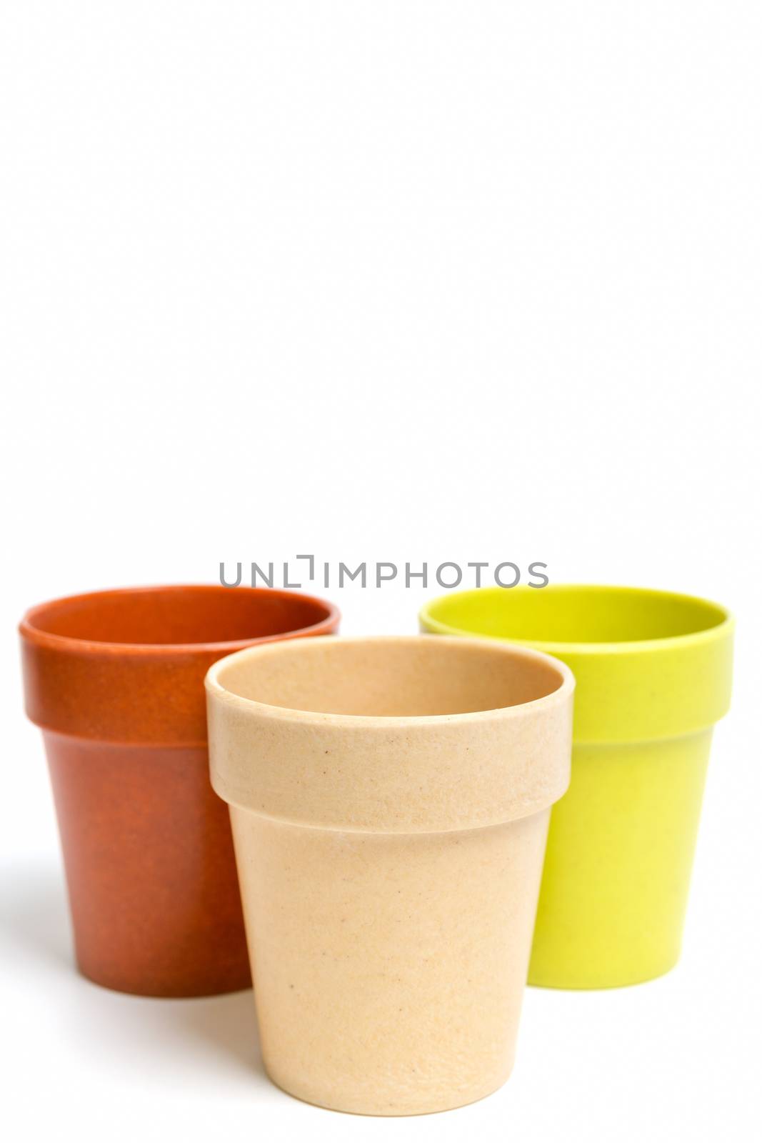 Recycled materials biodegradable tree pot isolated on a white background