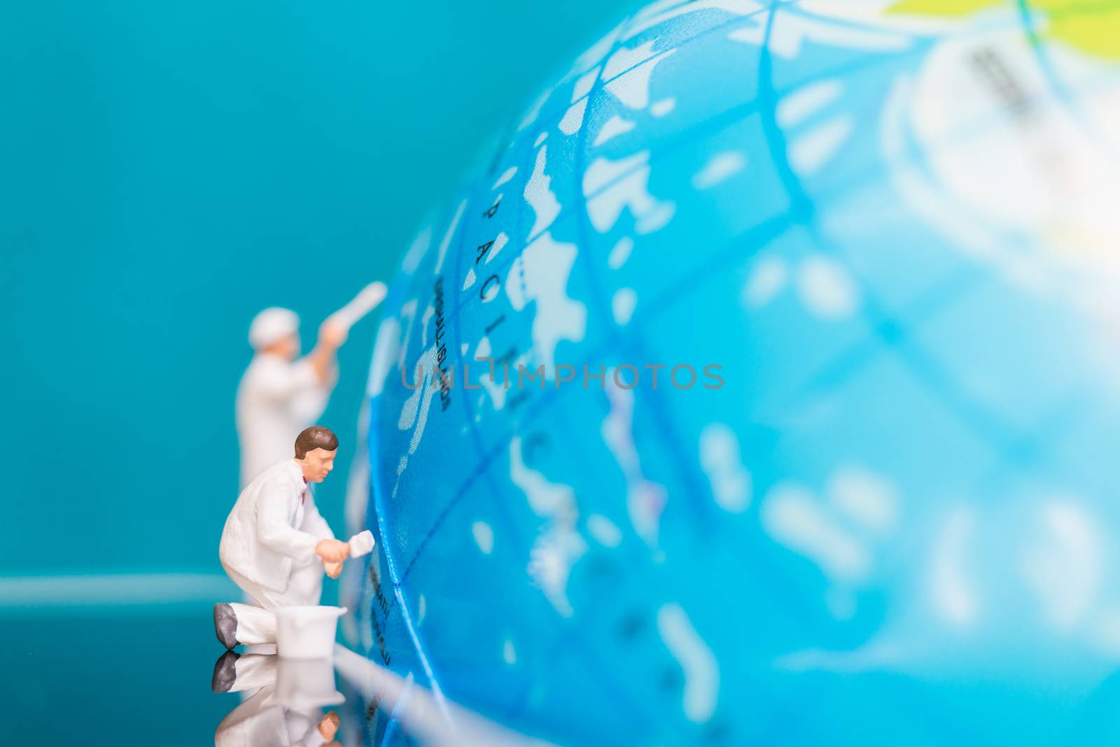 Miniature people : Painters painting on The globe  background , Earth day concept