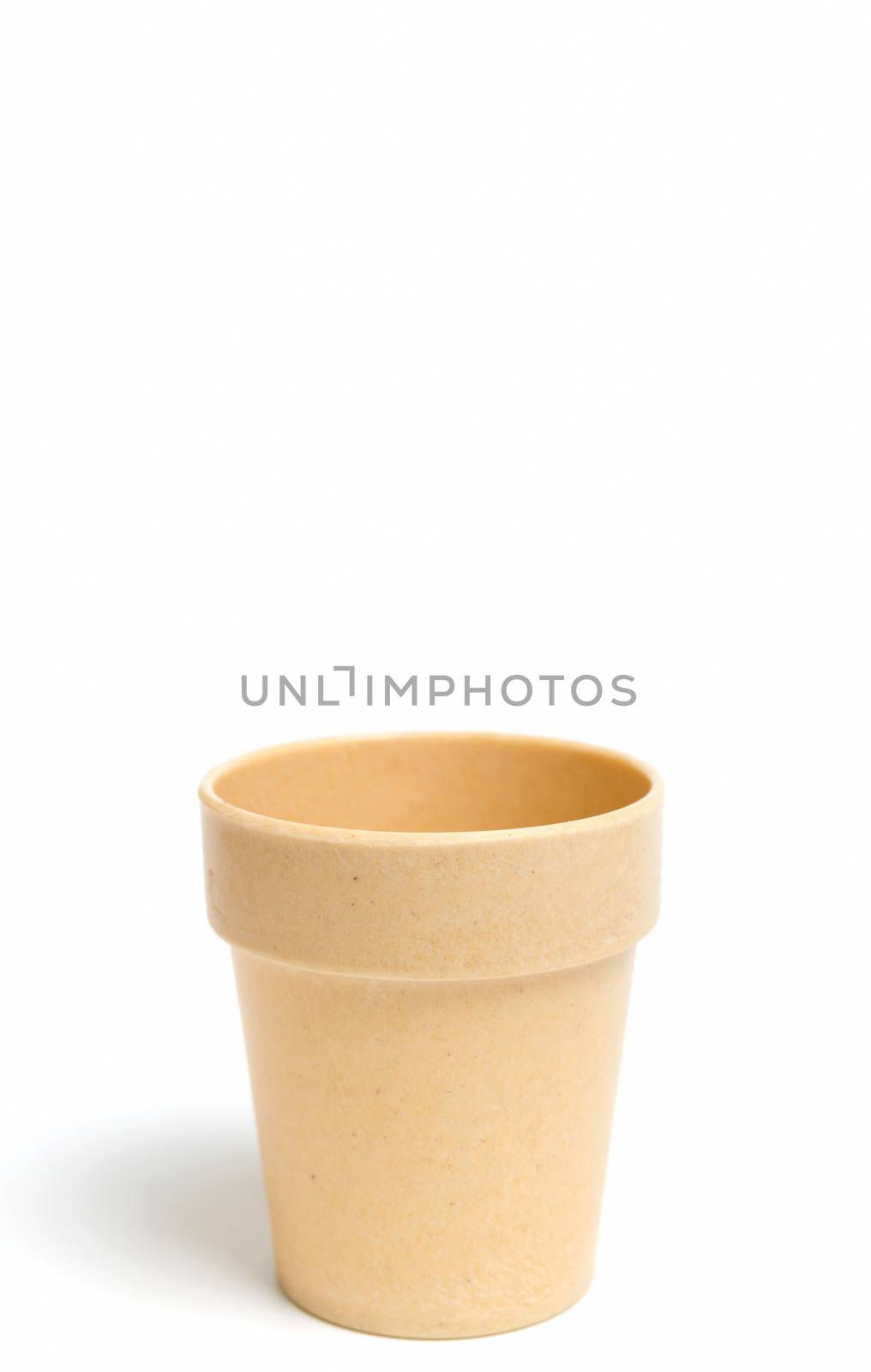 Recycled materials biodegradable tree pot isolated on a white background
