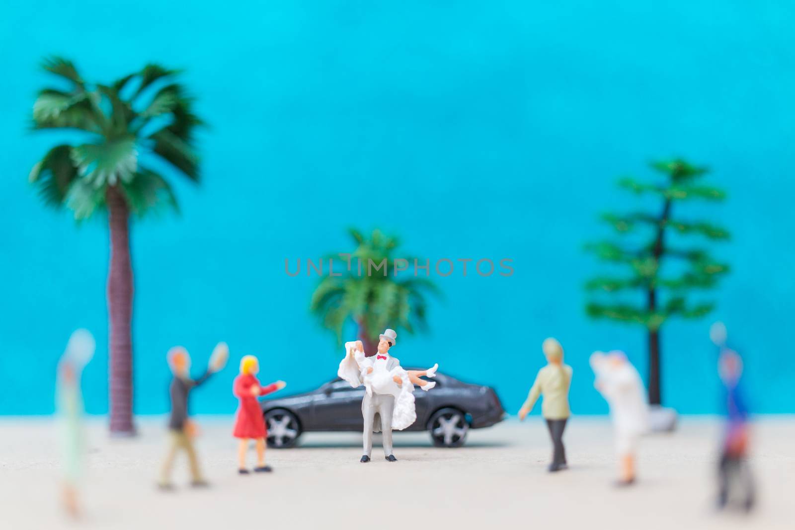 Miniature people, Bride and groom on the beach , Wedding concept