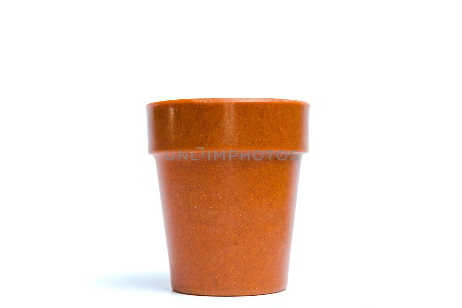 Recycled materials biodegradable tree pot isolated on a white background