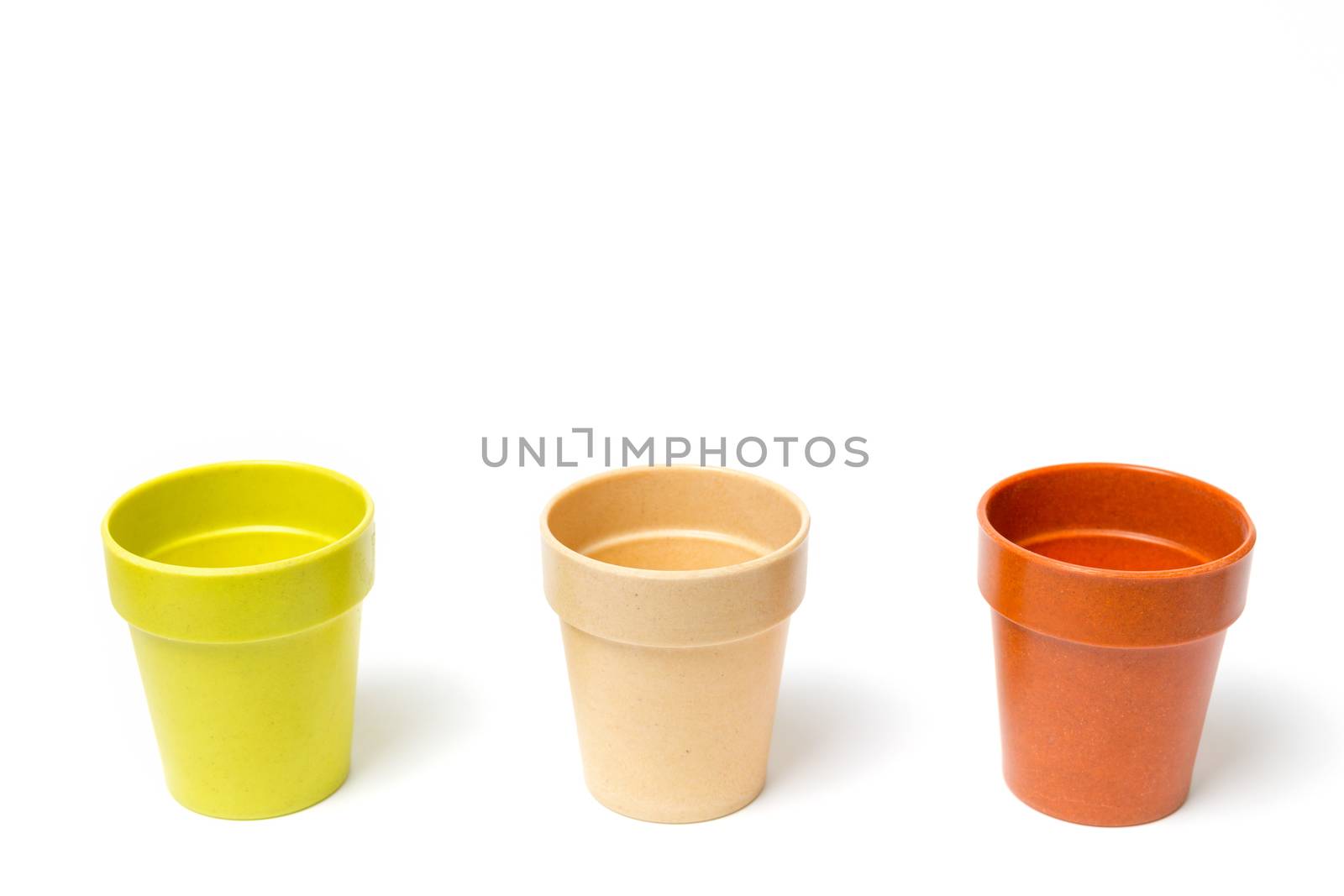 Recycled materials biodegradable tree pot isolated on a white background