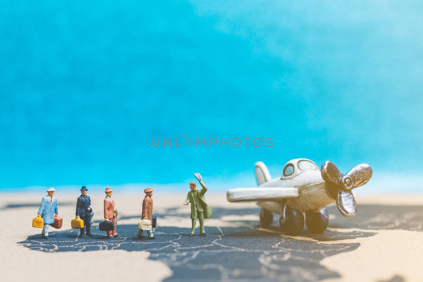 Miniature people : Travellers with airplane on The world map , Travel and business concept.