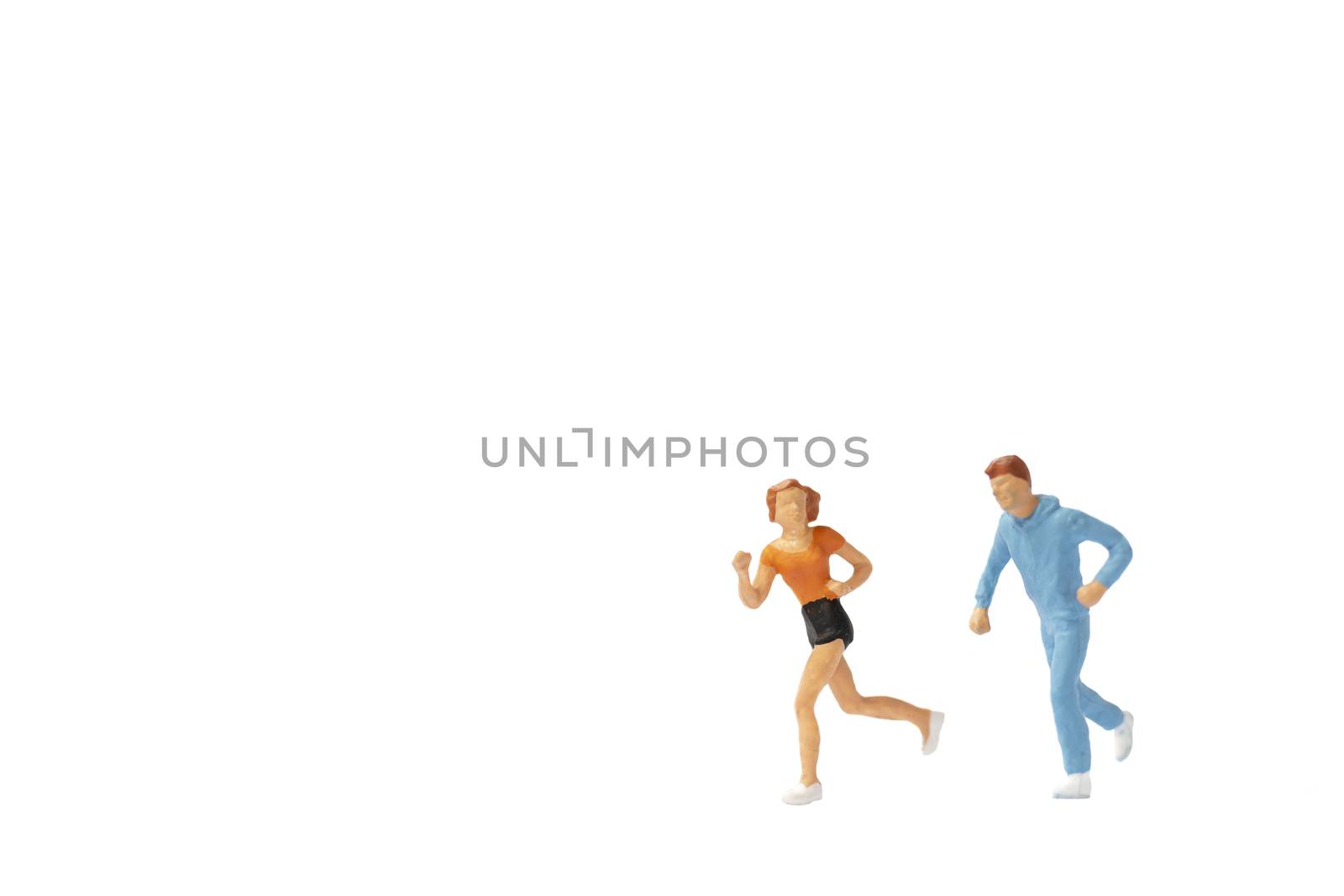 Miniature people : Couple running on white background by sirichaiyaymicro