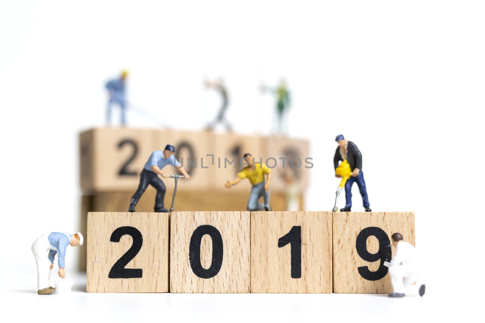 Miniature worker team painting number 2019 on white background , Happy new year 2019 concept