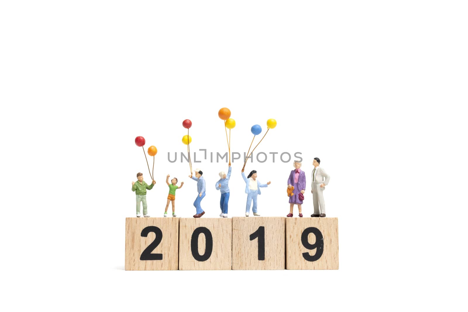 Miniature people : Happy family holding balloon on Number 2019 and copy space for text