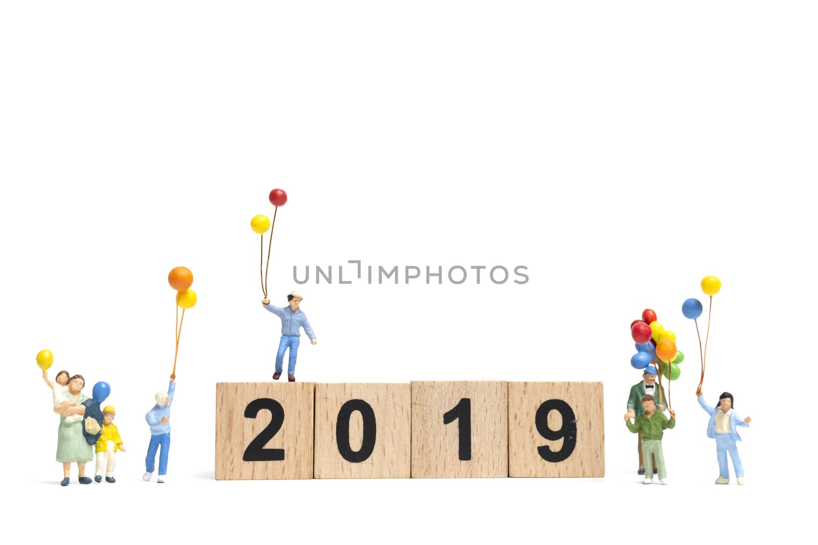 Miniature people : Happy family holding balloon on Number 2019 and copy space for text