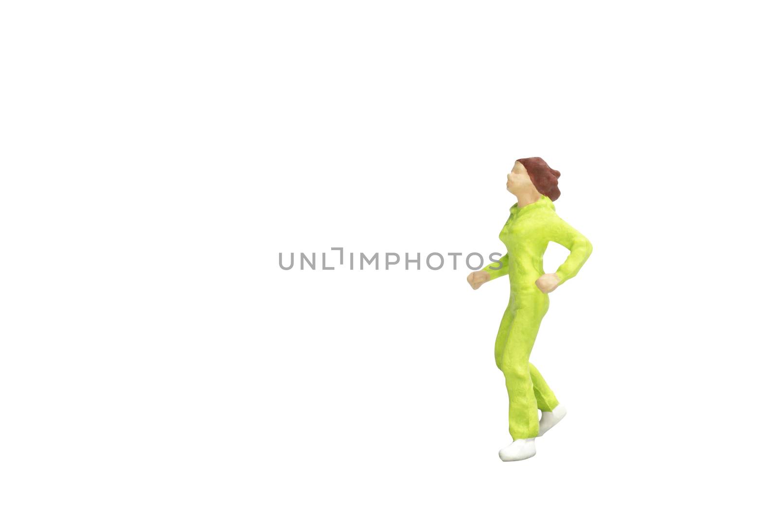 Miniature people running isolated on white background with clipping path
