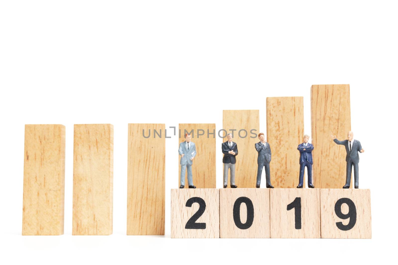 Miniature people : businessman  standing and thinking on wooden block number 2019. on white background