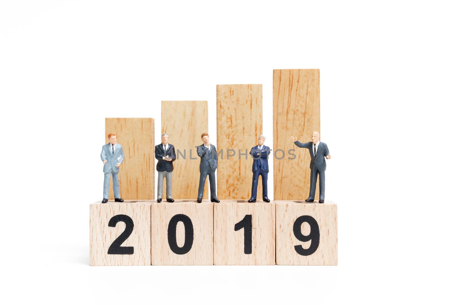 Miniature people : businessman  standing and thinking on wooden block number 2019. on white background