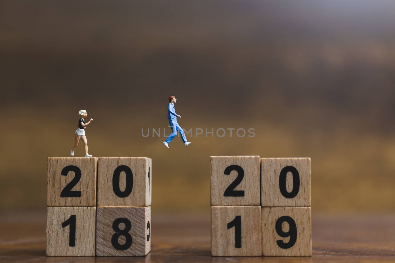 Miniature people  Running on wooden block number 2019 , Healthy lifestyle and sport concepts. by sirichaiyaymicro
