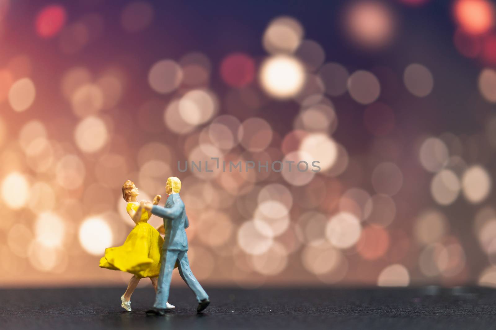 Miniature people , Couple dancing with bokeh background , Valentine's day concept