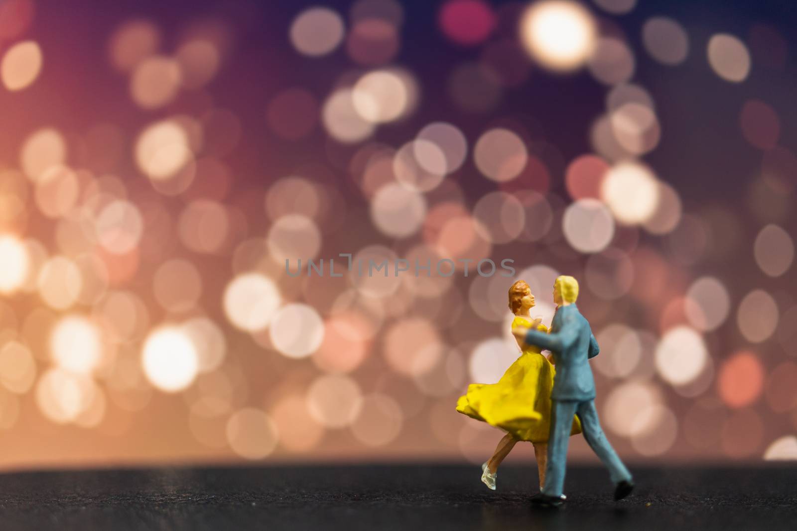 Miniature people , Couple dancing with bokeh background , Valentine's day concept