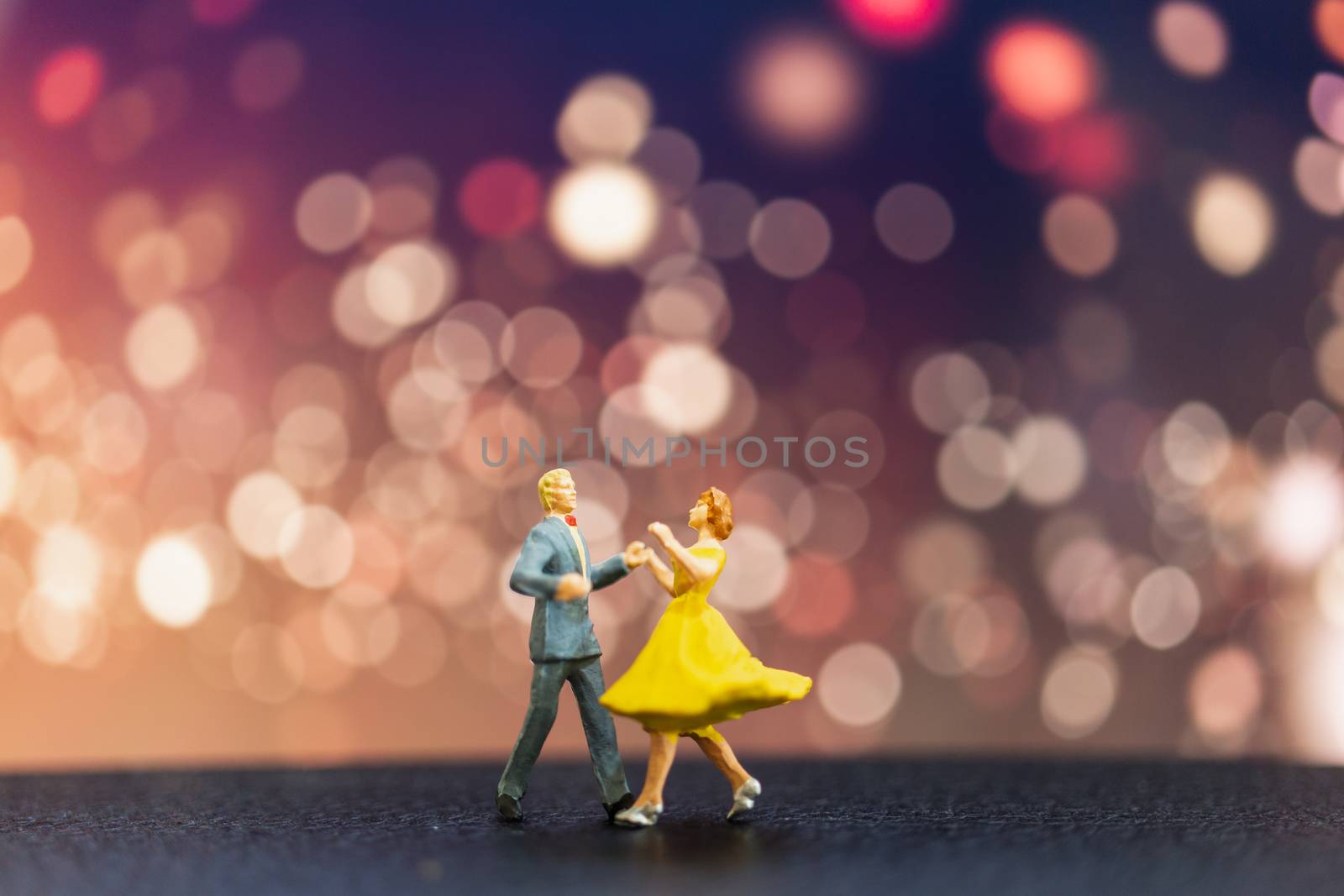 Miniature people , Couple dancing with bokeh background , Valentine's day concept