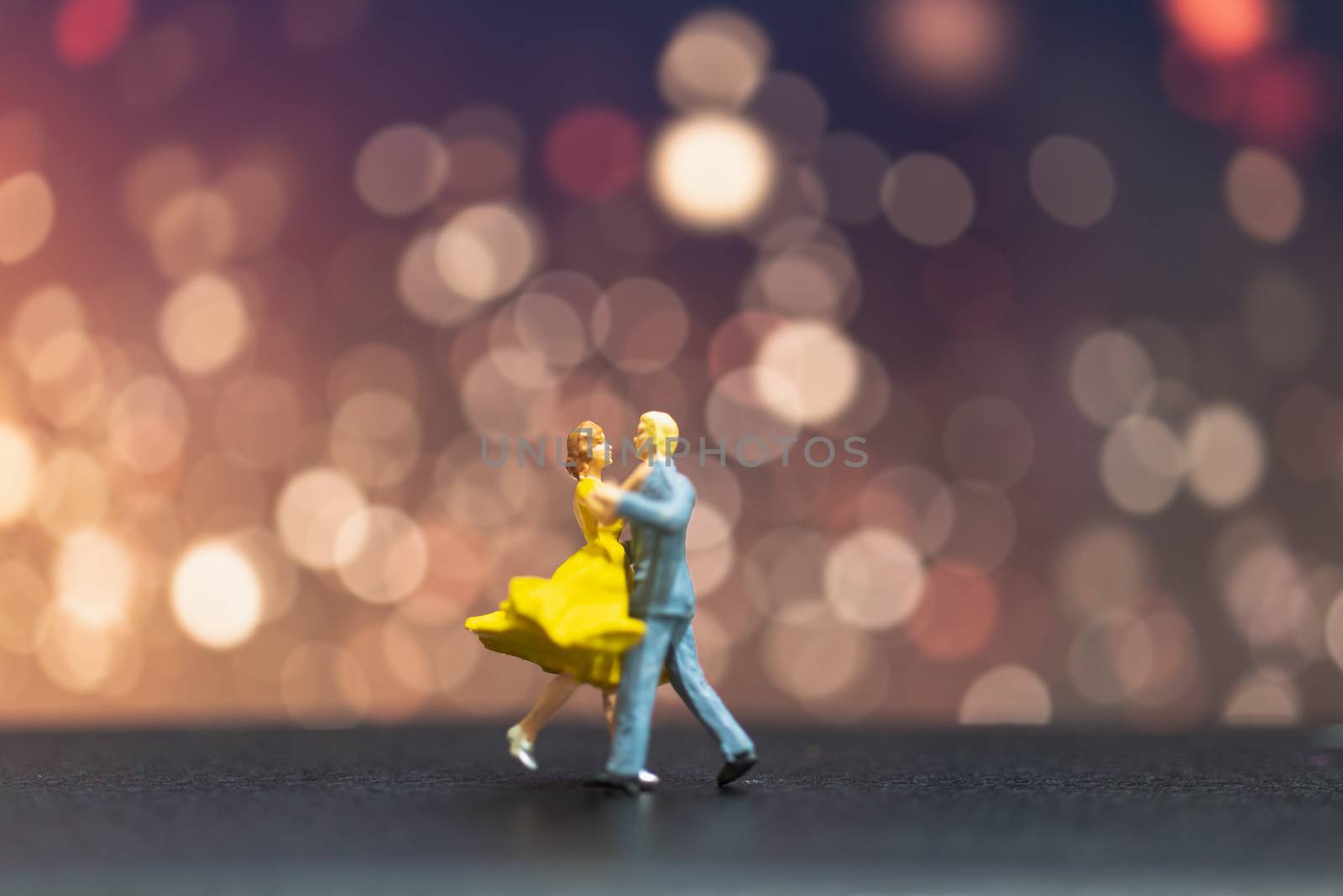 Miniature people , Couple dancing with bokeh background , Valentine's day concept