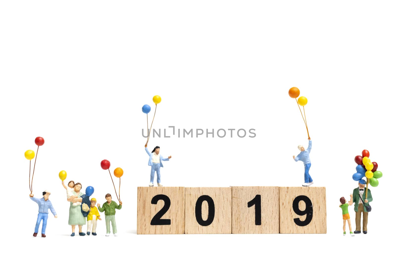 Miniature people : Happy family holding balloon on Number 2019 and copy space for text