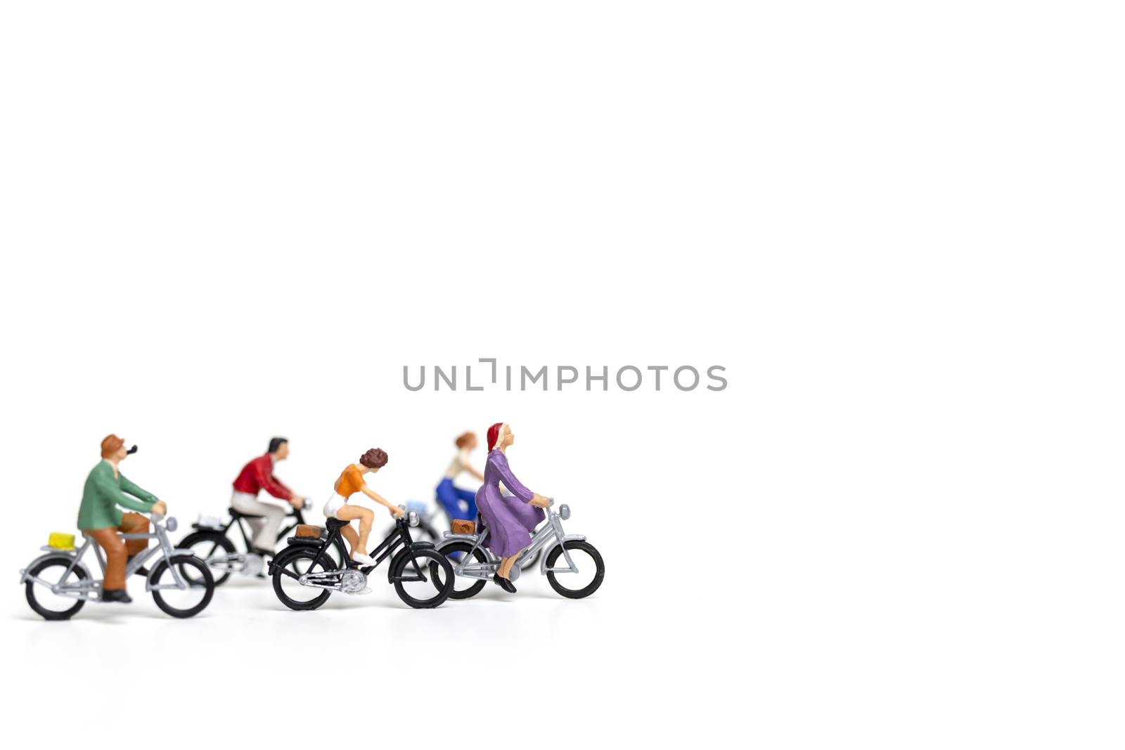 Miniature people : Friend Group ride bicycle  isolate on white background , Travel concept