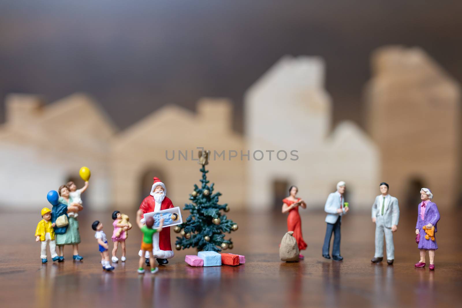 Miniature people: Santa Claus and happy family   , Merry Christmas and Happy New Year concept.