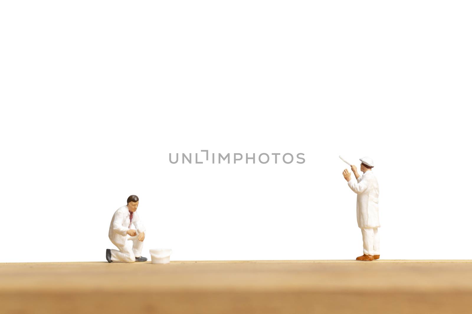 Miniature people : Painter holding a brush isolated on white and clipping path