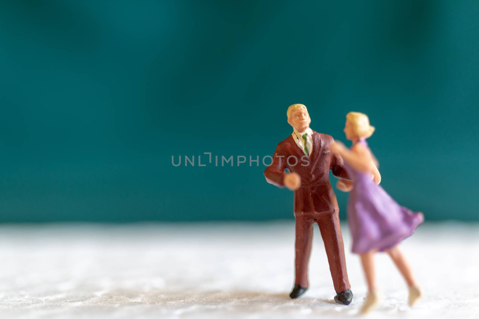 Miniature people , Couple dancing on the floor  , Valentine's day concept