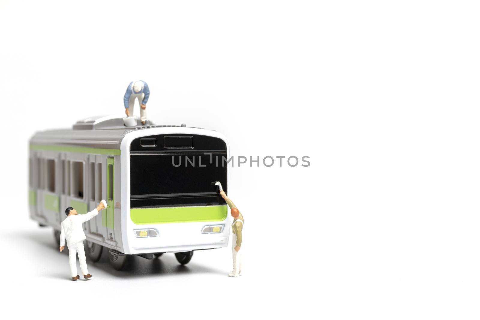 Miniature people : Painters painting a Train on white background , Repairing concept