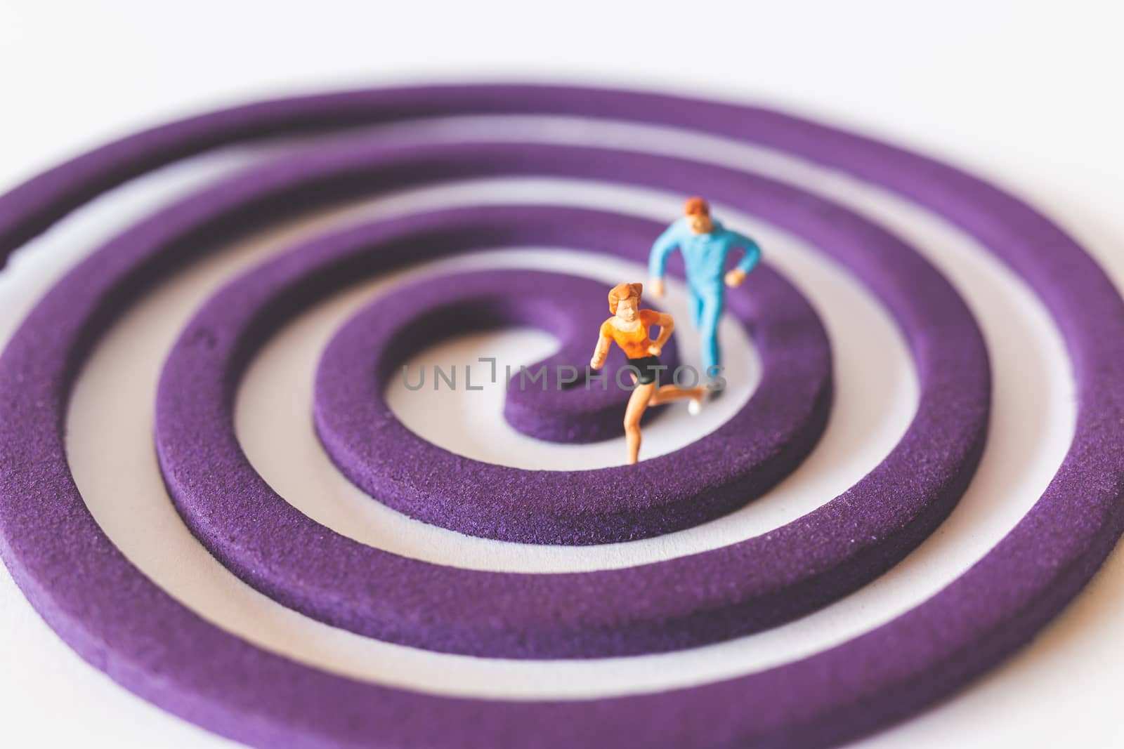 Miniature people : Couple Runnig on the purple field , Valentine's Day concept