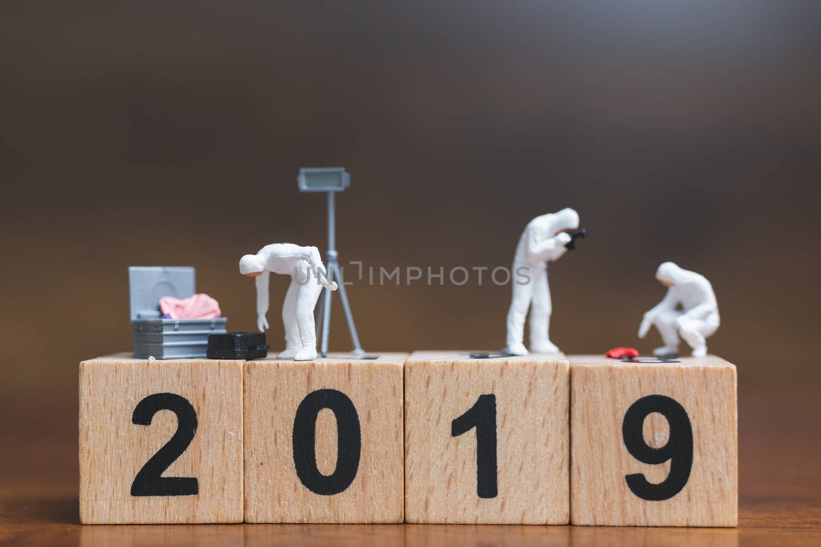 Miniature people :Crime Scene Investigation on wooden block Number 2019