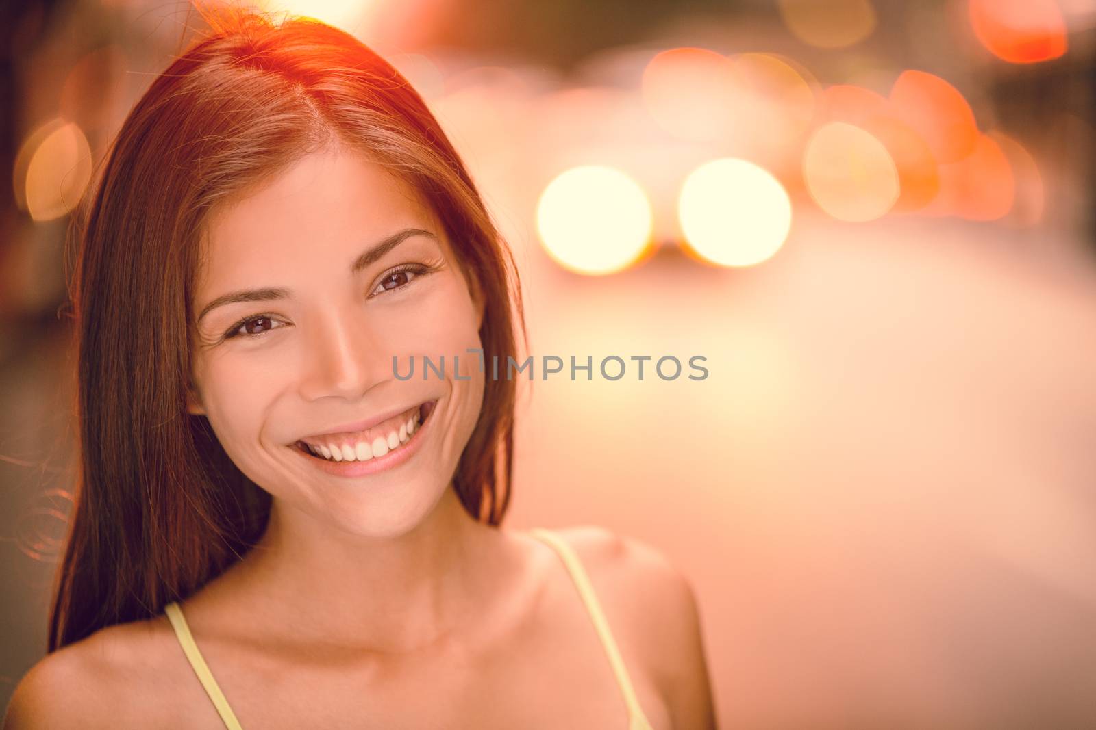 Asian girl smiling happy portrait on NYC city street. Sunset summer outdoor young woman enjoying life, healthy living by Maridav