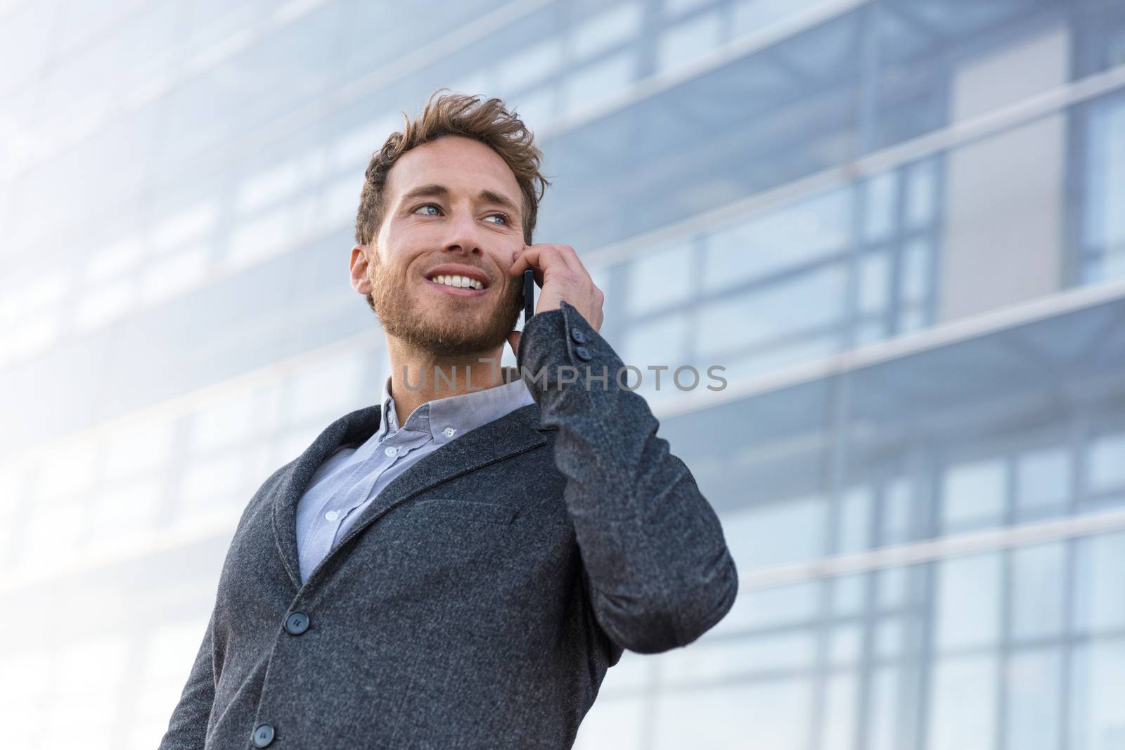 Businessman calling talking on the phone having business negotiation conversation by Maridav