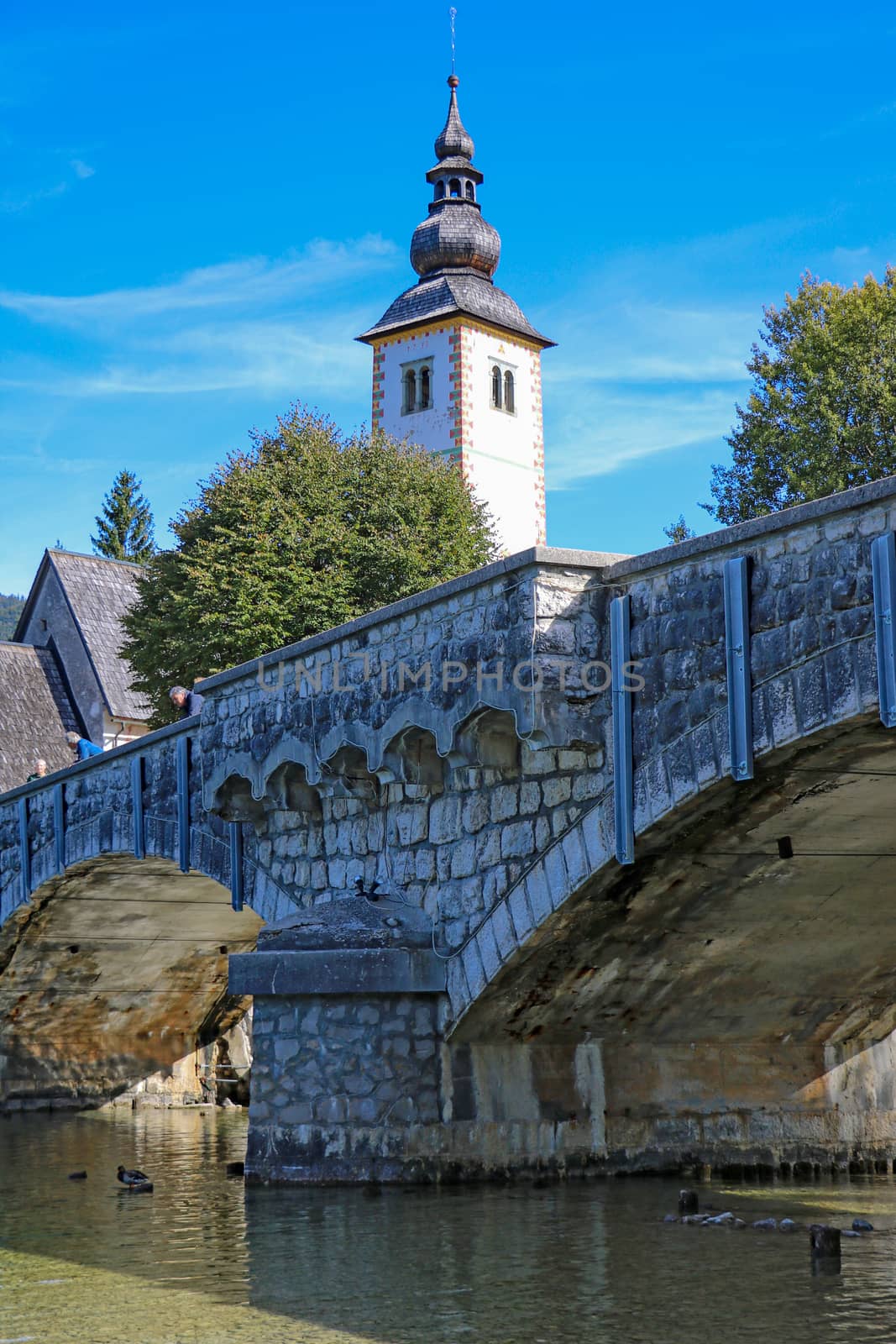 Church of St. John the Baptist and a bridge by the Bohinj lake, Slovenia