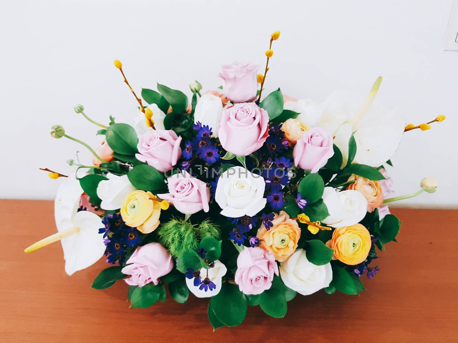 Bouquet of roses in basket by uphotopia