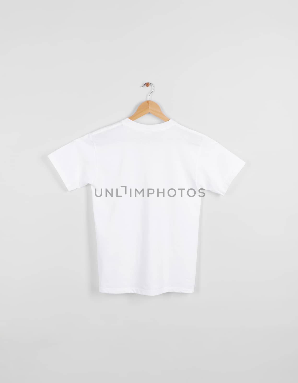 Mockup blank back white T-shirt hanging isolated on gray background.