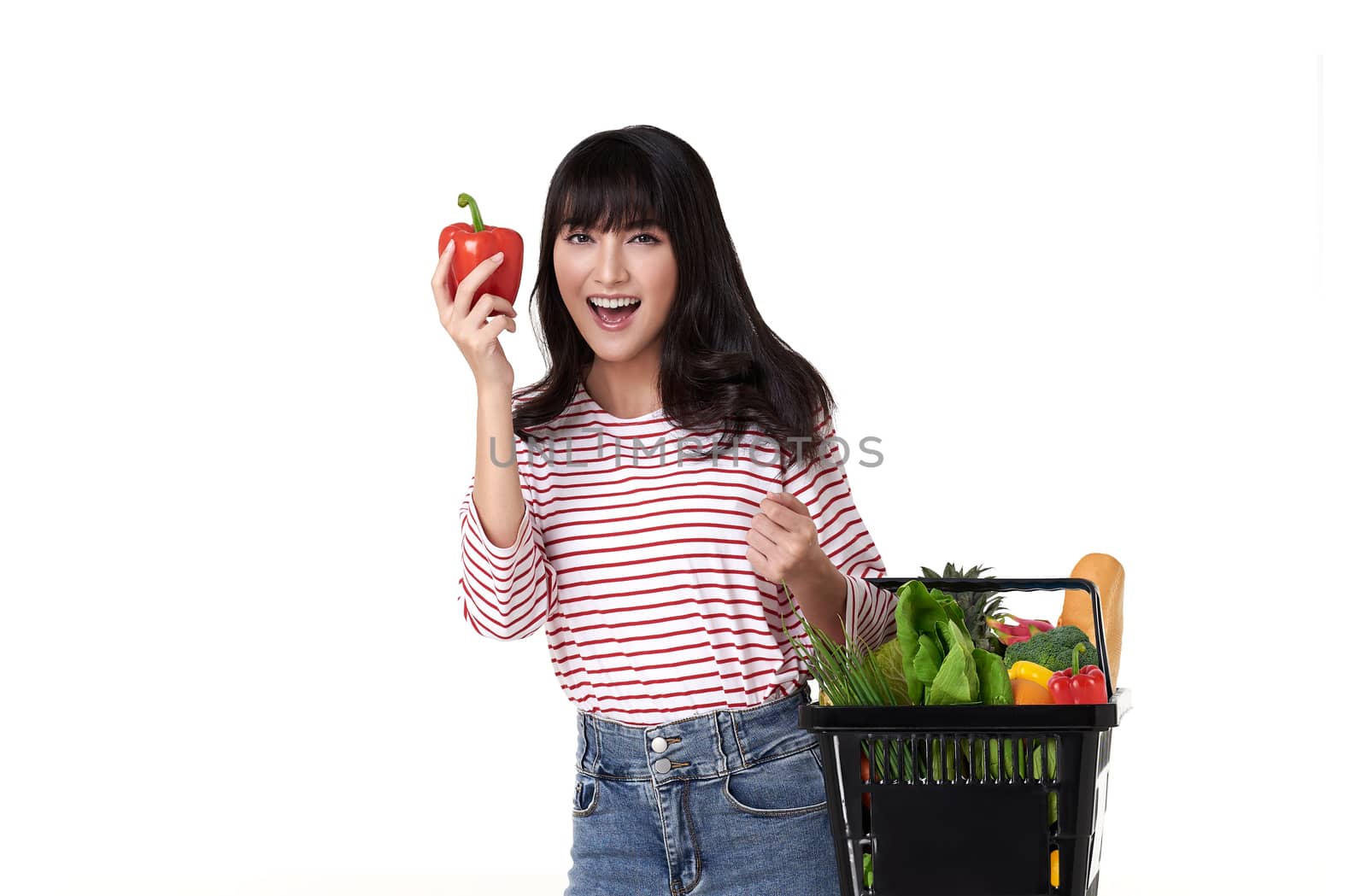 Happy smiling Asian woman holding basket shopping full of vegetables isolated on white background. by barameeyay