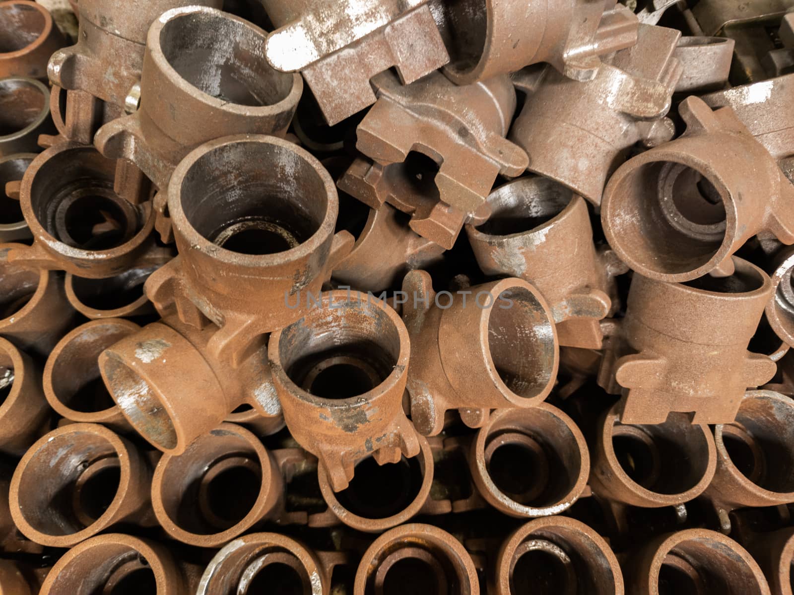 rusted metal parts close-up background with selective focus. improper factory storage issue