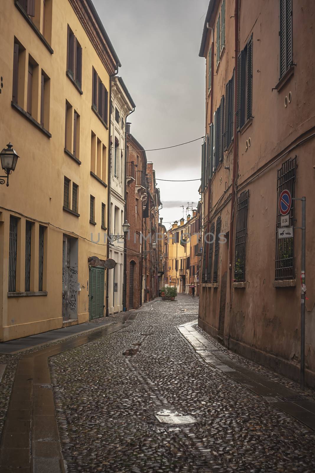 An historical alley in Ferrara in Italy by pippocarlot
