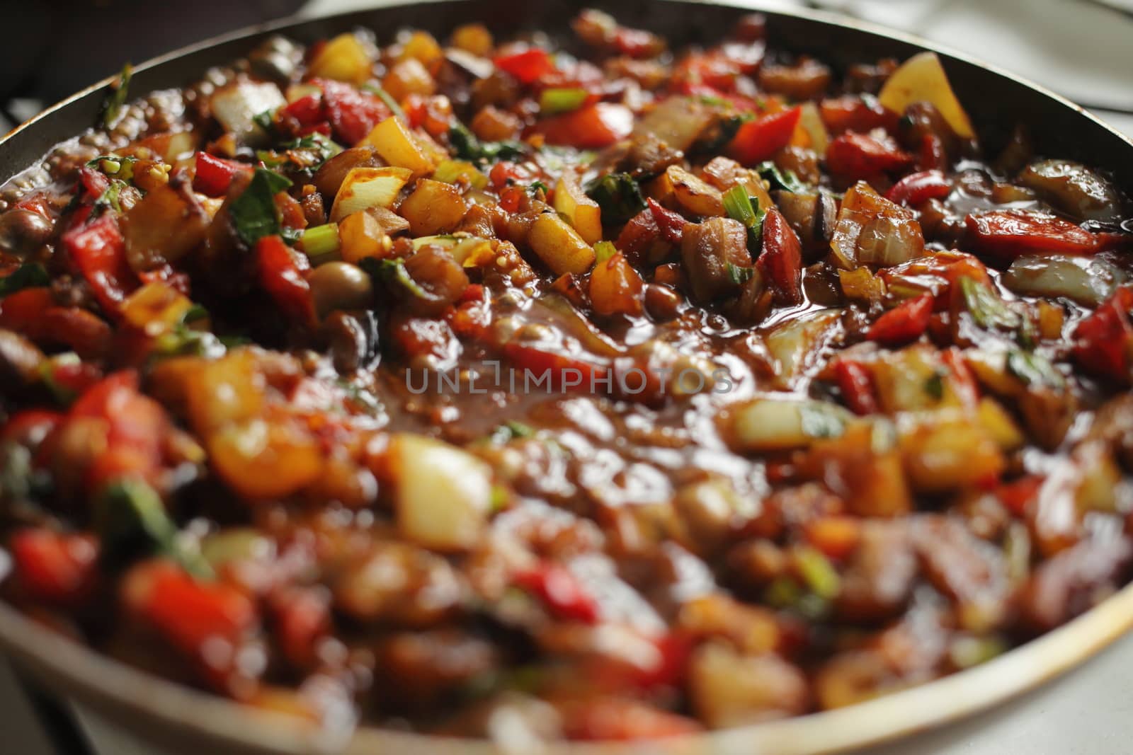 Healthy food vegetables are fried in a pan Tomato eggplant onion pepper zucchini by selinsmo