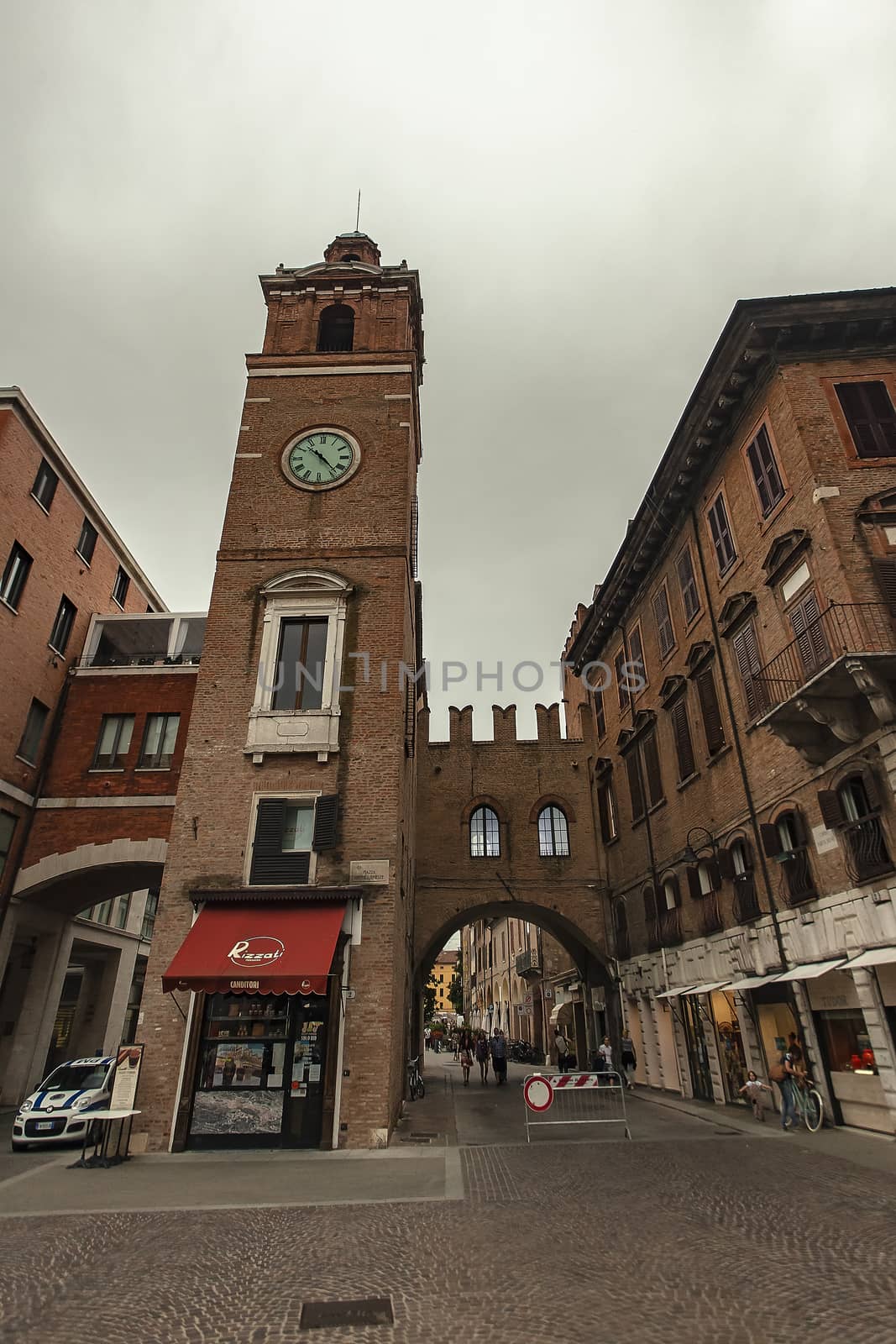 FERRARA, ITALY 29 JULY 2020 : Clock Tower from below in Ferrara in Italy