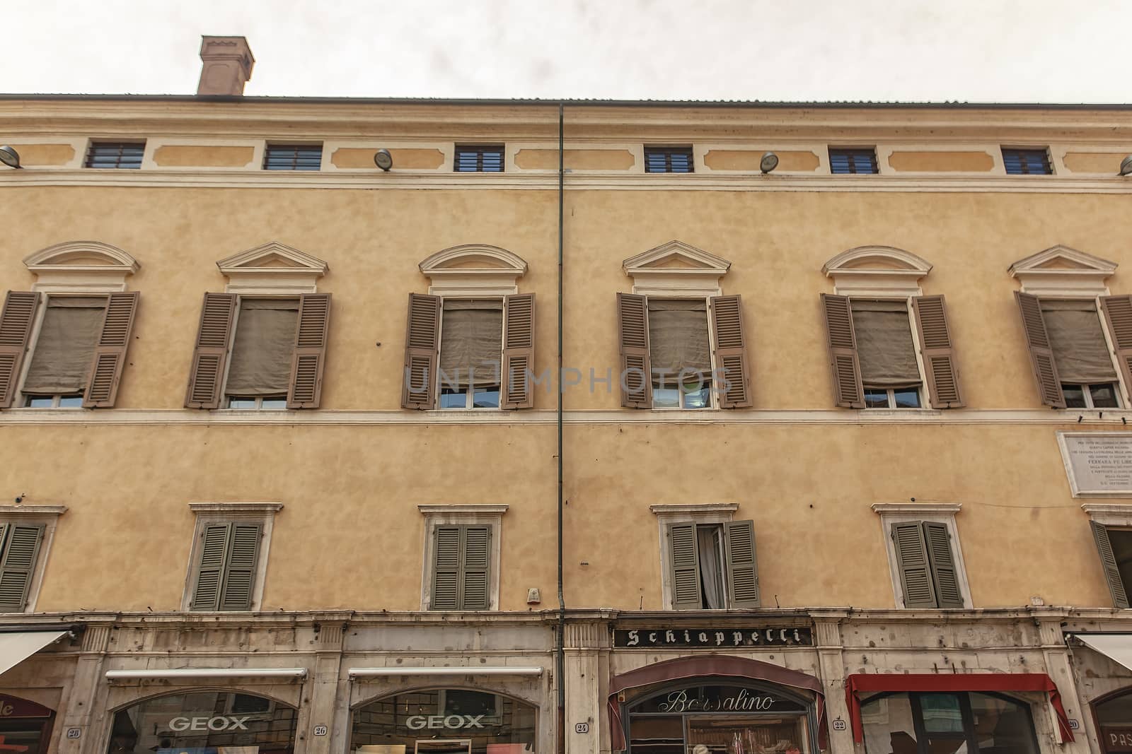 FERRARA, ITALY 29 JULY 2020 : Ancient building with many windows in Ferrara in Italy