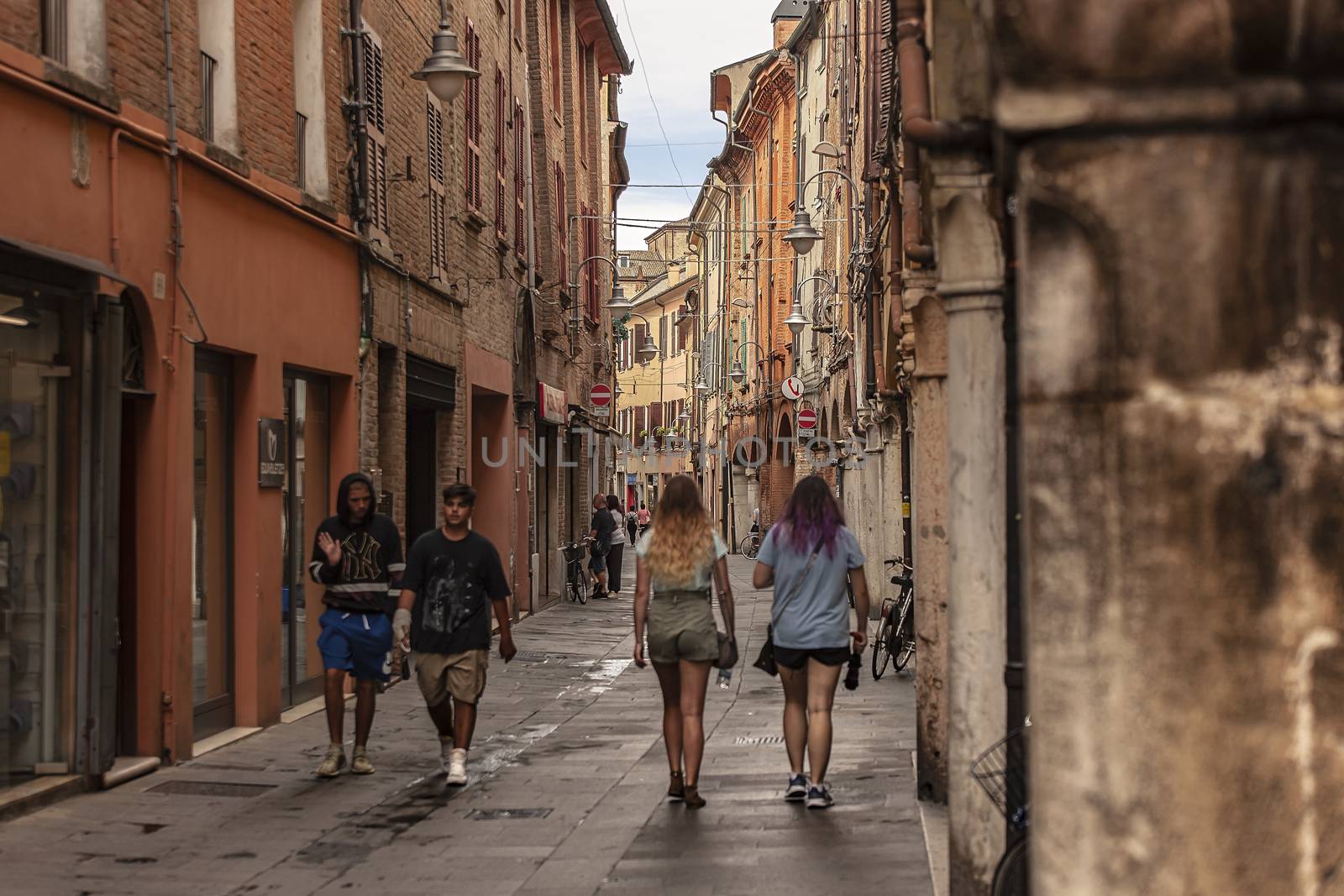 Alley of Ferrara in Italy full of people walking 4 by pippocarlot
