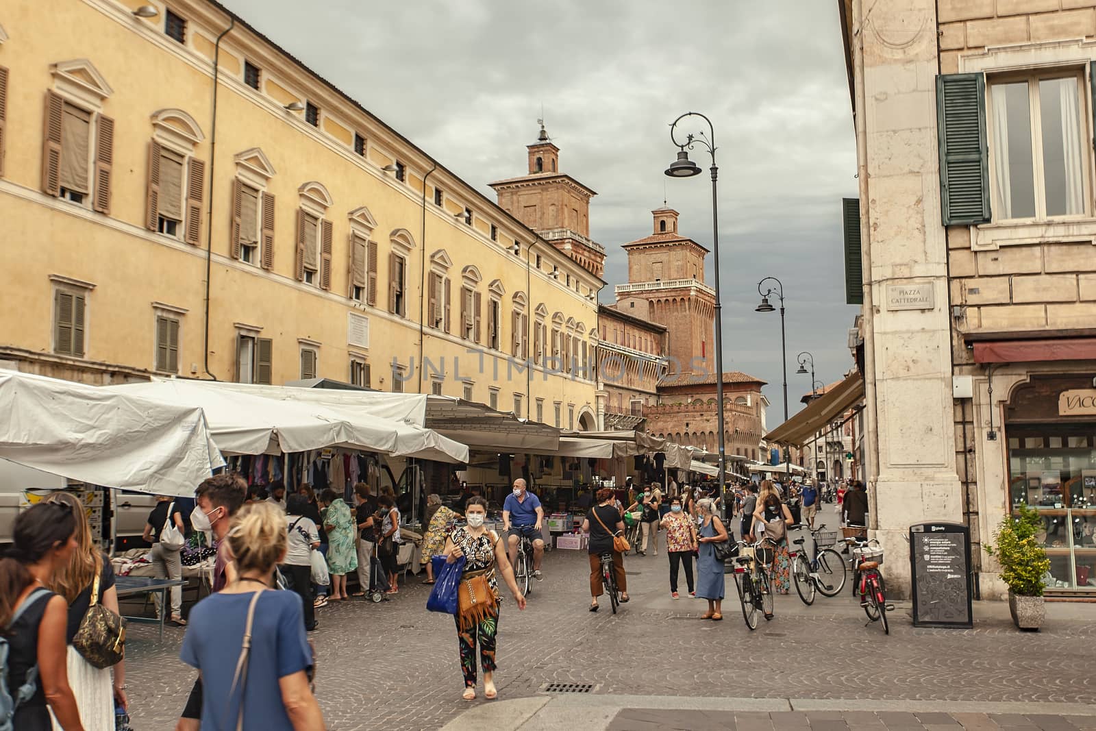 FERRARA, ITALY 29 JULY 2020 : Piazza del municipio in Ferrara in Italy a famous square in the city full of people