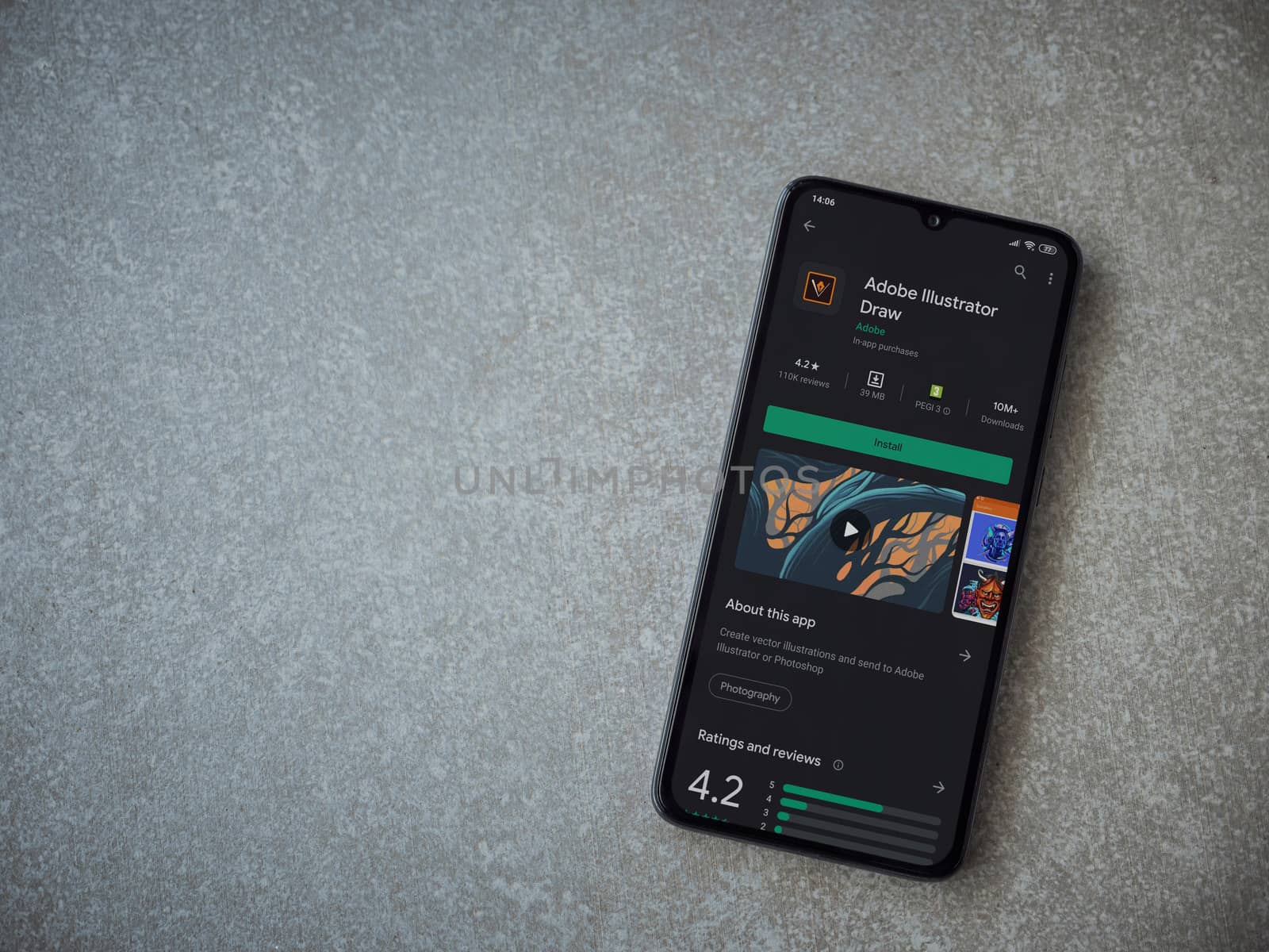 Lod, Israel - July 8, 2020: Adobe Illustrator Draw app play store page on the display of a black mobile smartphone on ceramic stone background. Top view flat lay with copy space.