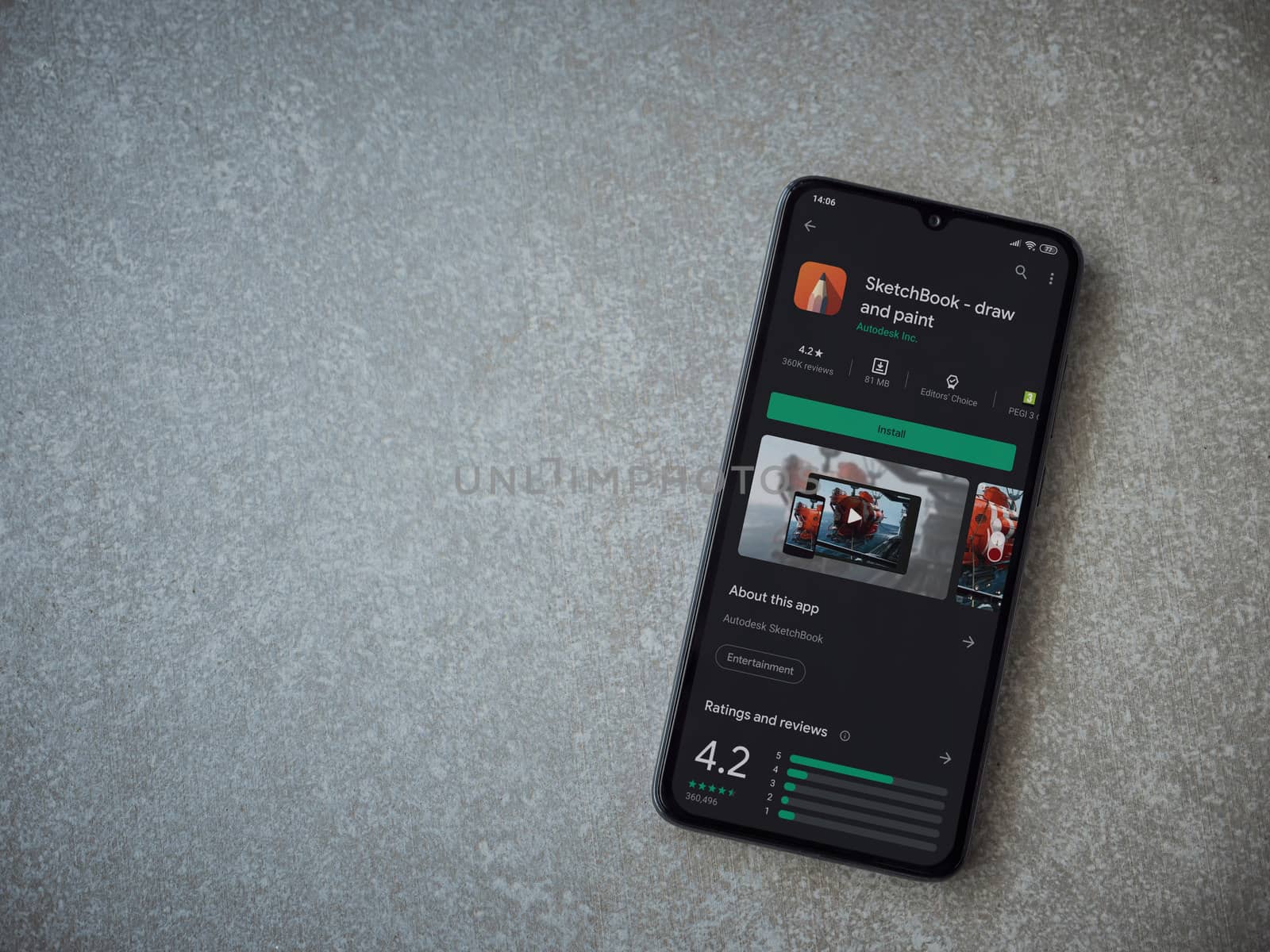 Lod, Israel - July 8, 2020: Autodesk SketchBook - draw and paint app play store page on the display of a black mobile smartphone on ceramic stone background. Top view flat lay with copy space.