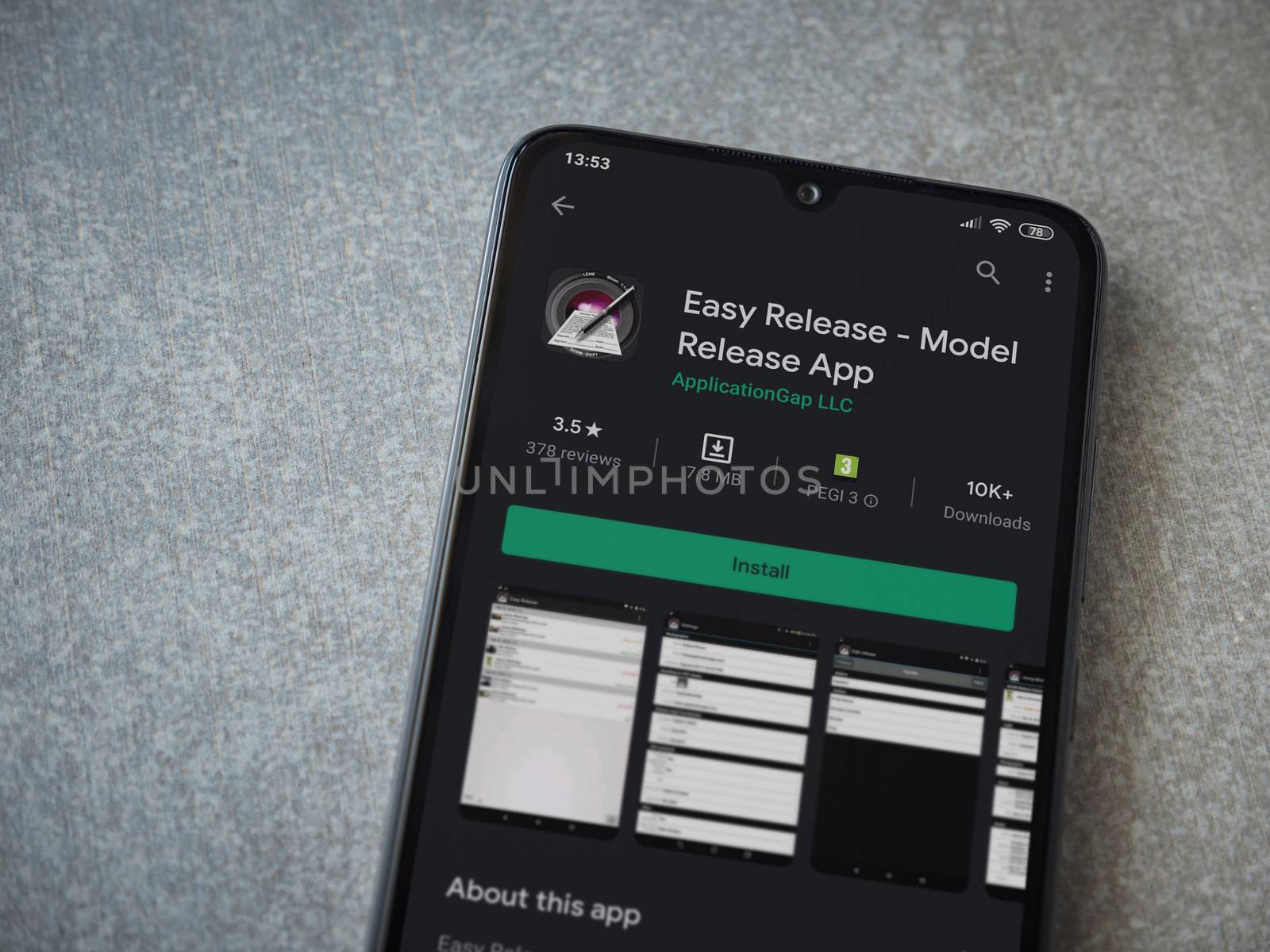 Lod, Israel - July 8, 2020: Easy Release Pro - Model Release app play store page on the display of a black mobile smartphone on ceramic stone background. Top view flat lay with copy space. 