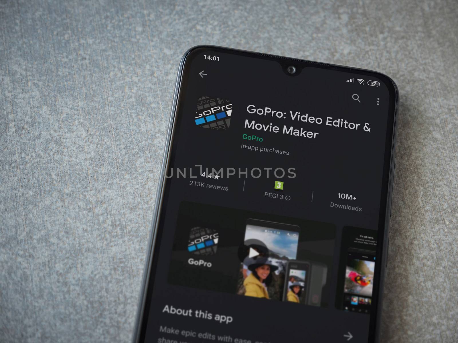 Lod, Israel - July 8, 2020: GoPro - Video Editor and Movie Maker app play store page on the display of a black mobile smartphone on ceramic stone background. Top view flat lay with copy space.