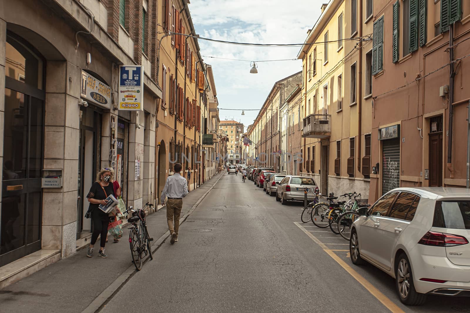 FERRARA, ITALY 29 JULY 2020 : People in street life in Ferrara in Italy