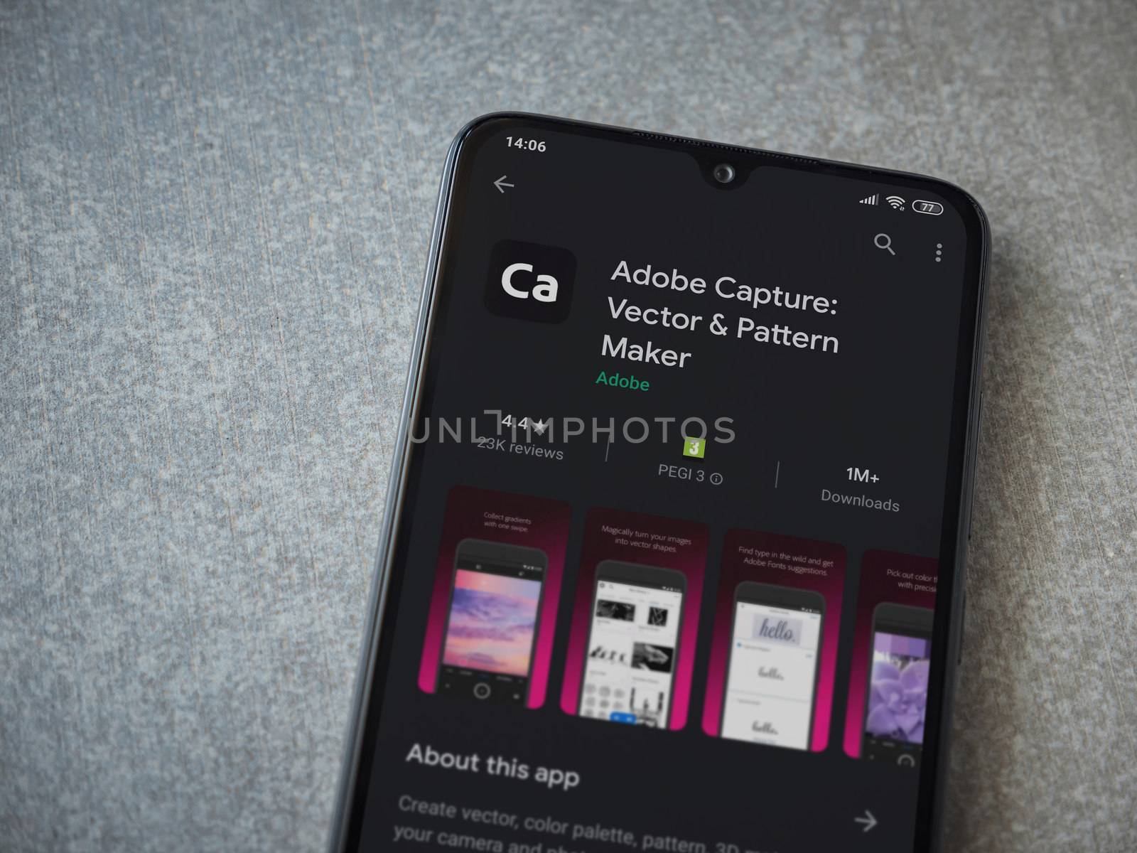 Lod, Israel - July 8, 2020: Adobe Capture - Vector and Pattern Maker app play store page on the display of a black mobile smartphone on ceramic stone background. Top view flat lay with copy space.
