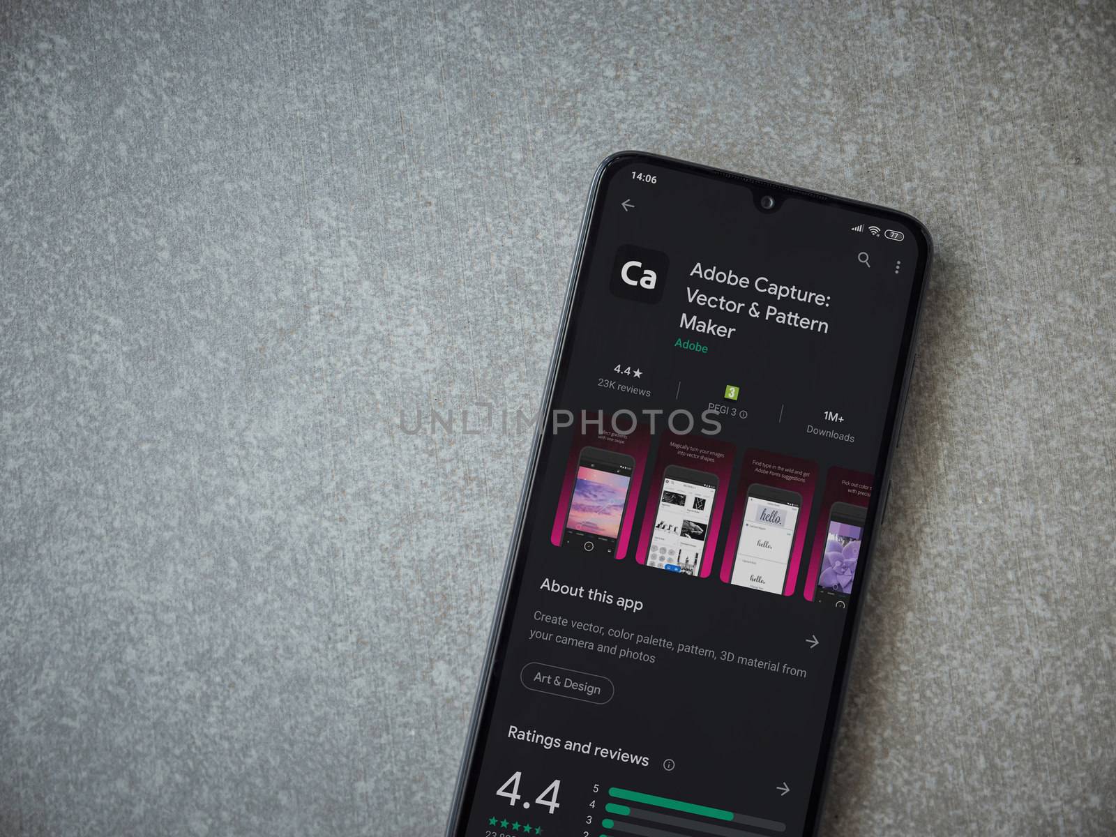 Lod, Israel - July 8, 2020: Adobe Capture - Vector and Pattern Maker app play store page on the display of a black mobile smartphone on ceramic stone background. Top view flat lay with copy space.
