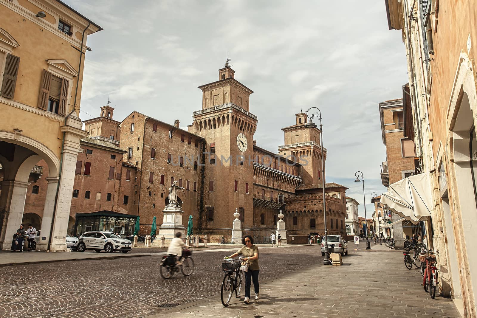 Evocative view of the castle of Ferrara with people and tourists by pippocarlot