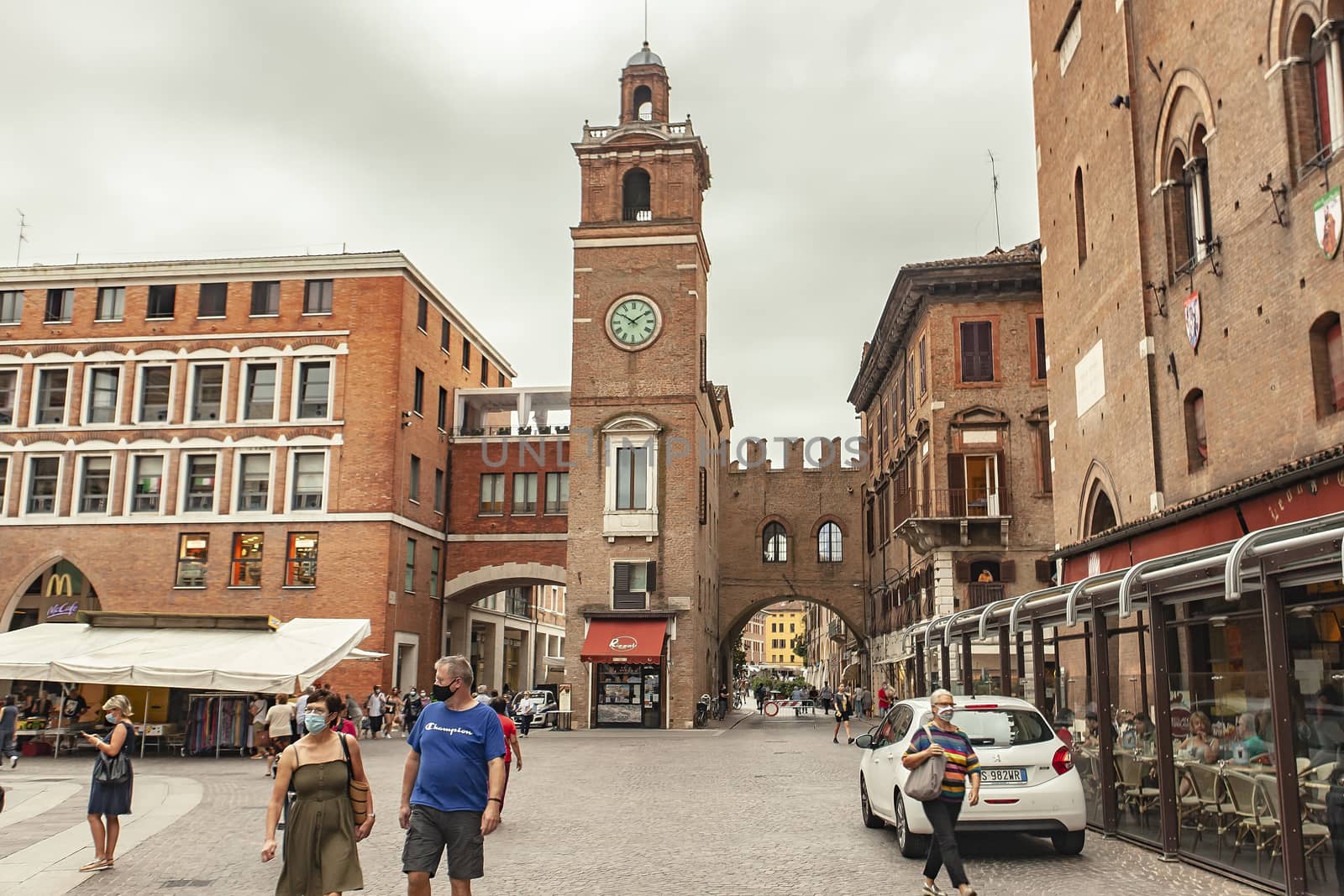 FERRARA, ITALY 29 JULY 2020 : Piazza del municipio in Ferrara in Italy a famous square in the city full of people